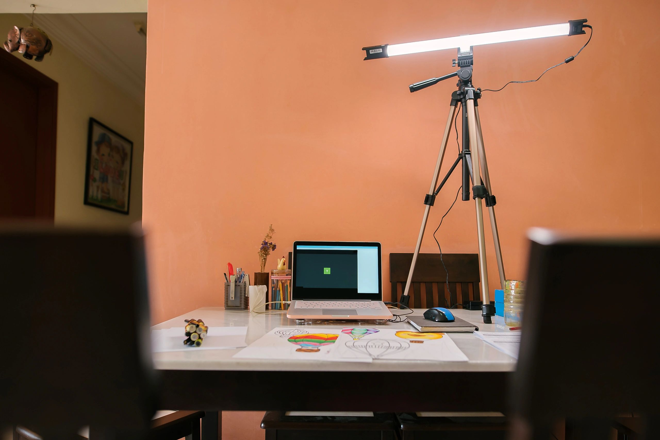 Creative workspace with presentation tools and design materials