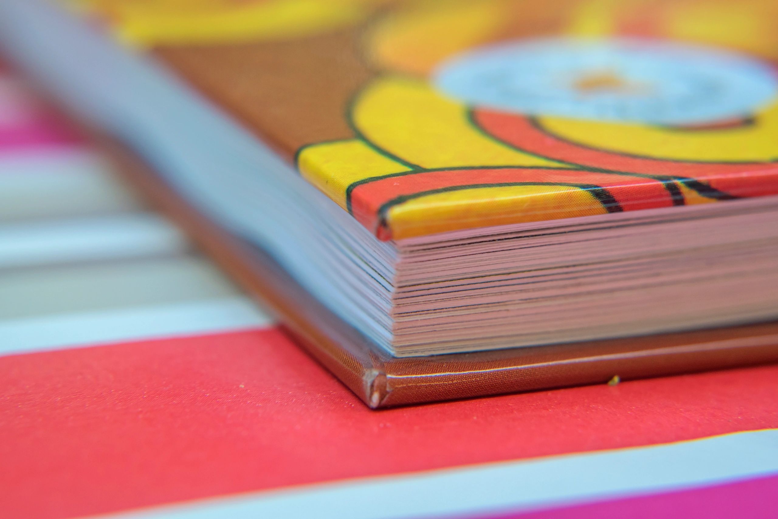 Book edge close-up representing printed catalog craftsmanship
